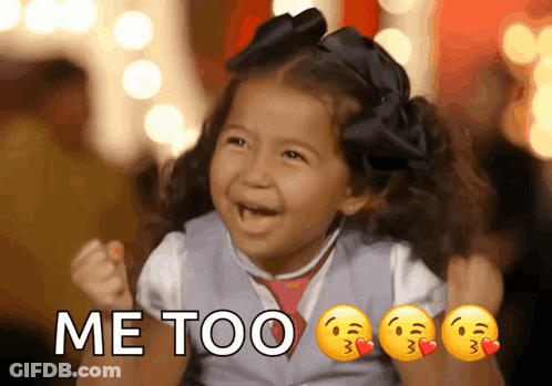 A Little Girl Is Holding Her Fist In The Air With The Words Me Too Written Above Her GIF