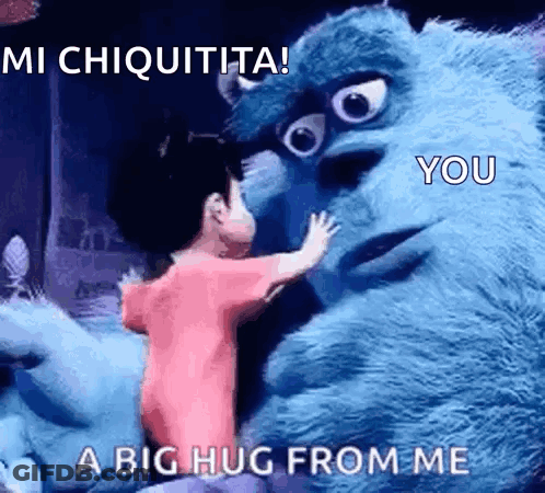 A Little Girl Is Hugging A Monster From Monsters Inc GIF
