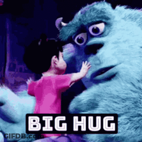 A Little Girl Is Hugging A Stuffed Animal From Monsters Inc . GIF