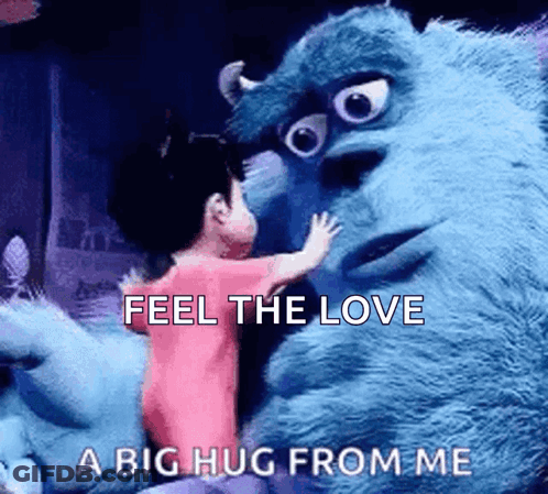 A Little Girl Is Hugging A Stuffed Animal From Monsters Inc . GIF
