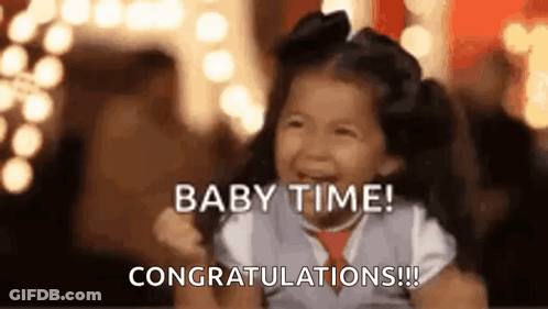 A Little Girl Is Laughing And Crying While Being Held By A Person . GIF