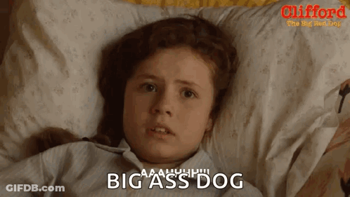 A Little Girl Is Laying On A Bed With A Pillow And The Words Big Ass Dog On The Bottom GIF