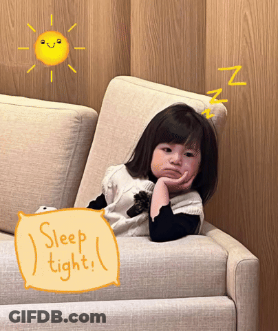A Little Girl Is Laying On A Couch With A Pillow That Says Sleep Tight GIF