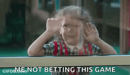 A Little Girl Is Looking Out Of A Window And Making A Funny Face While Saying `` Me Not Betting This Game '' . GIF