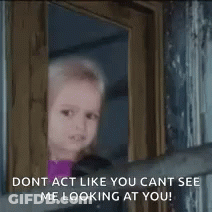 A Little Girl Is Looking Out Of A Window With The Words `` Dont Act Like You Cant See Me Looking At You '' . GIF