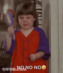A Little Girl Is Making A Funny Face While Holding A Broom And Making A Funny Face . GIF