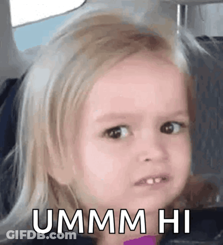 A Little Girl Is Making A Funny Face While Sitting In A Car . GIF