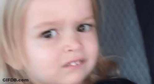 A Little Girl Is Making A Funny Face While Sitting In A Car Seat . GIF