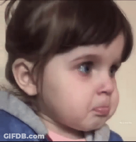 A Little Girl Is Making A Funny Face With Her Mouth Open . GIF