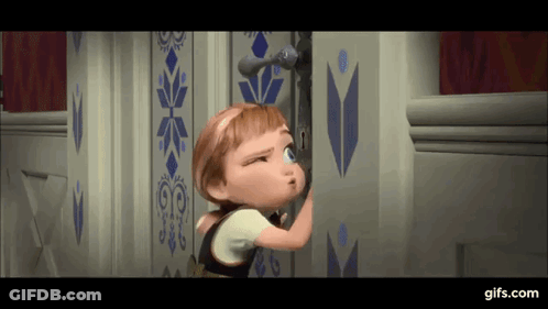 A Little Girl Is Peeking Out Of A Door In A Frozen Movie . GIF
