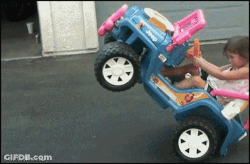 A Little Girl Is Playing With A Toy Jeep That Says Jeep GIF