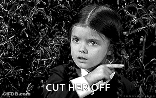 A Little Girl Is Pointing At Something In A Black And White Photo And Says `` Cut Her Off '' . GIF