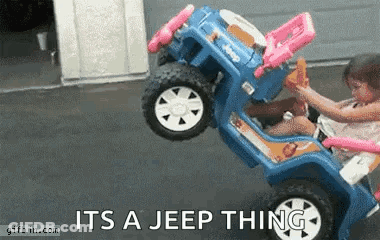A Little Girl Is Riding A Blue Toy Jeep With The Words " It 'S A Jeep Thing " On The Bottom GIF