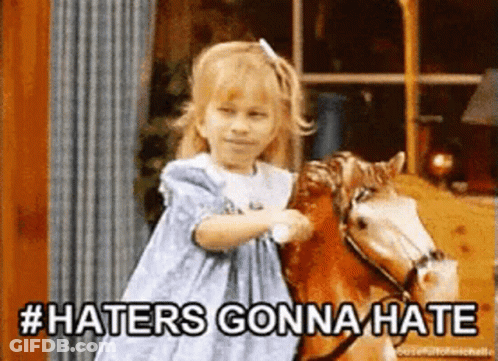 A Little Girl Is Riding A Rocking Horse With The Words Haters Gonna Hate Above Her GIF
