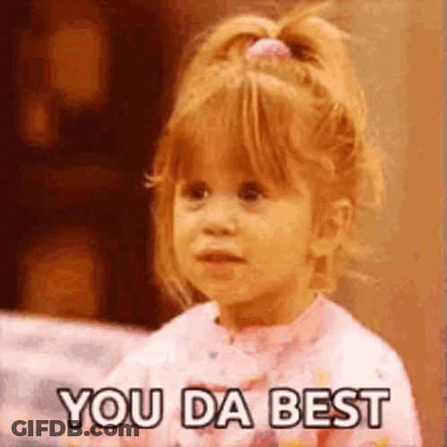 A Little Girl Is Saying `` You Da Best '' While Wearing A Pink Shirt . GIF