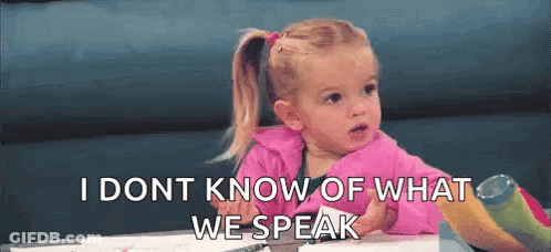 A Little Girl Is Sitting At A Table With The Words `` I Don T Know What We Speak '' Written On The Screen . GIF