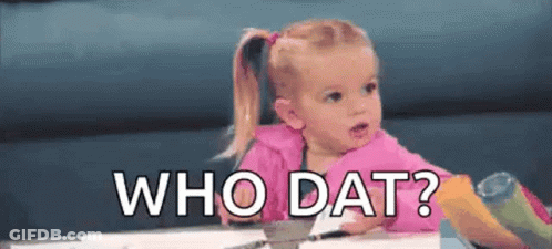 A Little Girl Is Sitting At A Table With The Words `` Who Dat '' Written Above Her . GIF