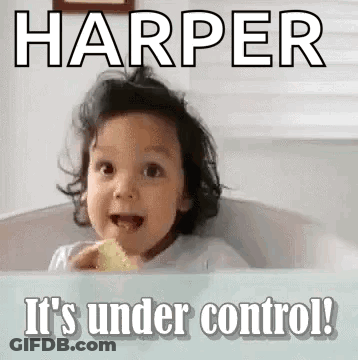 A Little Girl Is Sitting In A Bathtub Eating A Piece Of Food And Making A Face . GIF