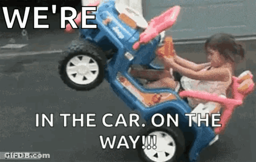 A Little Girl Is Sitting In A Toy Car With The Words We 'Re In The Car On The Way GIF