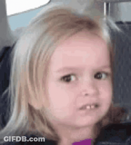 A Little Girl Is Sitting In The Back Seat Of A Car And Making A Funny Face . GIF