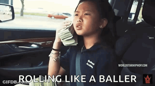 A Little Girl Is Sitting In The Back Seat Of A Car Holding A Pile Of Money . GIF