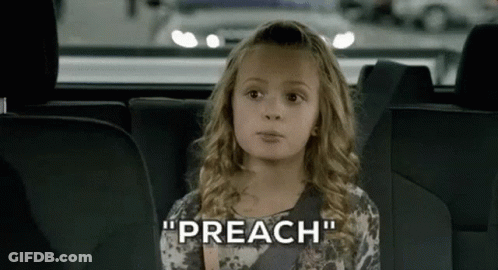 A Little Girl Is Sitting In The Back Seat Of A Car Talking . GIF
