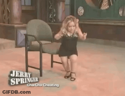 A Little Girl Is Sitting On A Chair On Jerry Springer 'S Show . GIF