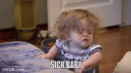 A Little Girl Is Sitting On A Couch And Making A Funny Face . GIF