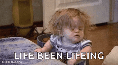 A Little Girl Is Sitting On A Couch With The Words `` Life Been Lifeing '' Written On The Floor . GIF