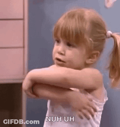 A Little Girl Is Standing In A Room With Her Arms Outstretched And A Ponytail . GIF