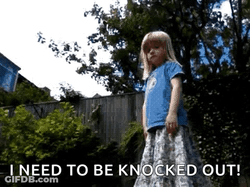 A Little Girl Is Standing In Front Of A Fence With The Words I Need To Be Knocked Out Below Her GIF