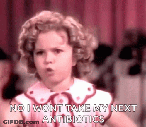 A Little Girl Is Standing In Front Of A Red Curtain And Says `` No I Won T Take My Next Antibiotics '' . GIF