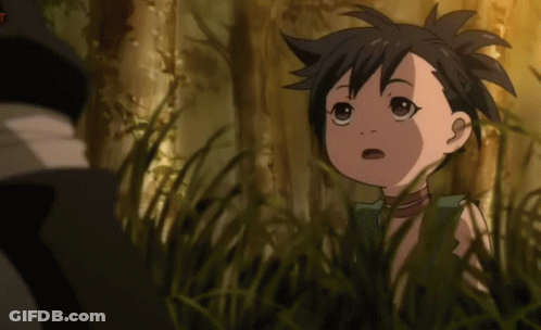 A Little Girl Is Standing In The Grass And Looking At Something GIF