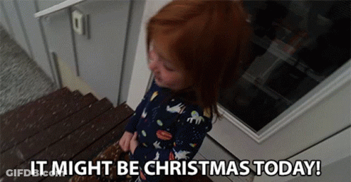 A Little Girl Is Standing On A Set Of Stairs With The Words `` It Might Be Christmas Today '' . GIF
