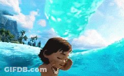 A Little Girl Is Swimming In The Ocean And Covering Her Face With Her Hand GIF