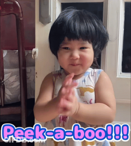 A Little Girl Making A Funny Face With The Words Peek-A-Boo Written Below Her GIF