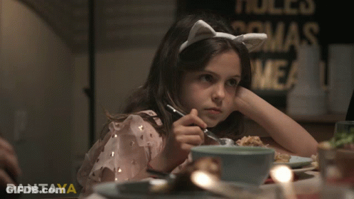 Girl Sitting At Table With Fork And Pantaya GIF