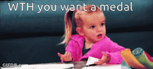A Little Girl Sitting At A Table With The Words " Wth You Want A Medal " Written Above Her GIF