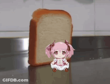 A Little Girl Sitting Next To A Loaf Of Bread GIF