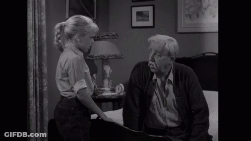 A Little Girl Talking To An Older Man With The Word No Visible In Yellow GIF