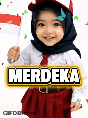 A Little Girl Wearing A Hijab And Tie Holds A Flag In Front Of A Sign That Says Merdeka GIF