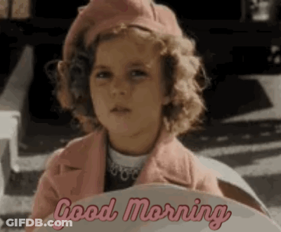 A Little Girl Wearing A Pink Coat And Beret Is Sitting In A Car And Says `` Good Morning '' . GIF