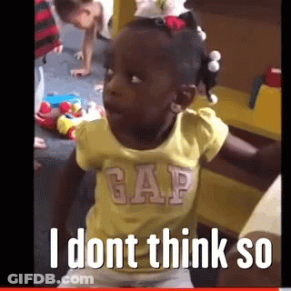 A Little Girl Wearing A Yellow Gap Shirt Is Sitting In A Room GIF