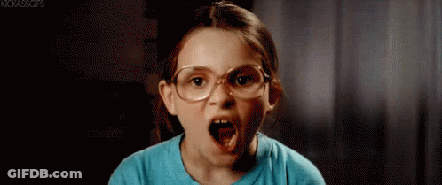 A Little Girl Wearing Glasses Is Making An Angry Face . GIF