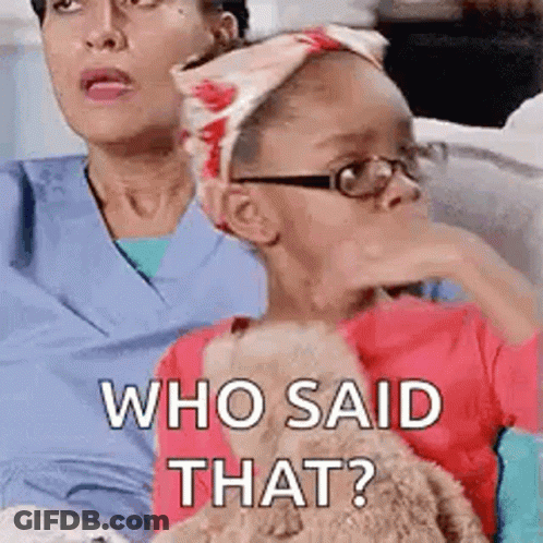 A Little Girl Wearing Glasses Is Sitting Next To A Woman Wearing Scrubs And A Headband . GIF