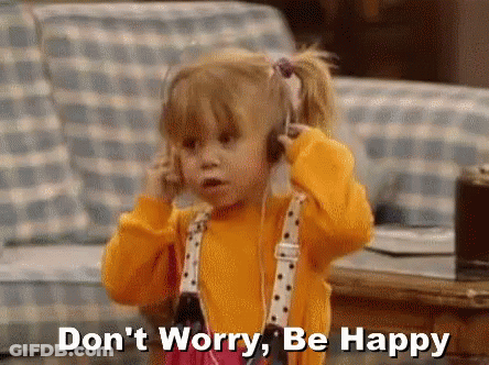 A Little Girl Wearing Headphones Is Talking On A Cell Phone And Says `` Don 'T Worry , Be Happy '' . GIF