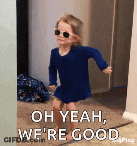 A Little Girl Wearing Sunglasses And A Blue Dress Is Dancing . GIF