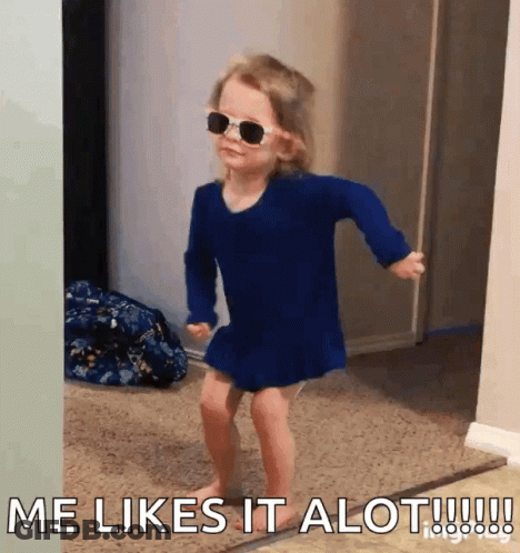 A Little Girl Wearing Sunglasses And A Blue Dress Says Me Likes It Alot !!! GIF