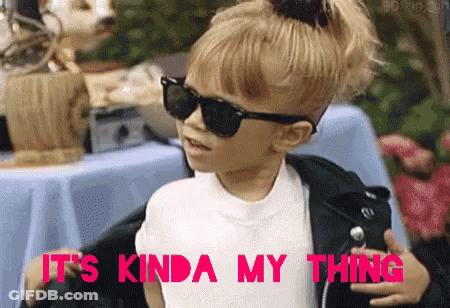 A Little Girl Wearing Sunglasses And A Leather Jacket Is Saying It 'S Kinda My Thing GIF