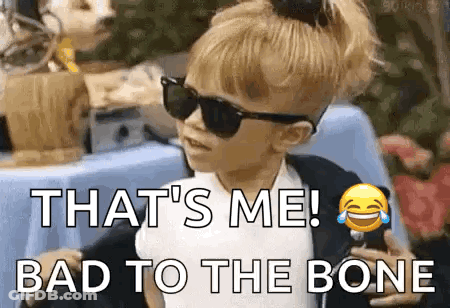 A Little Girl Wearing Sunglasses And A Ponytail Is Saying `` That 'S Me ! Bad To The Bone `` . GIF
